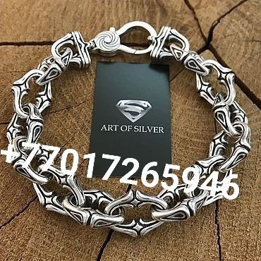 Art of Silver логотипімен күміс білезік және байланыс нөмірі