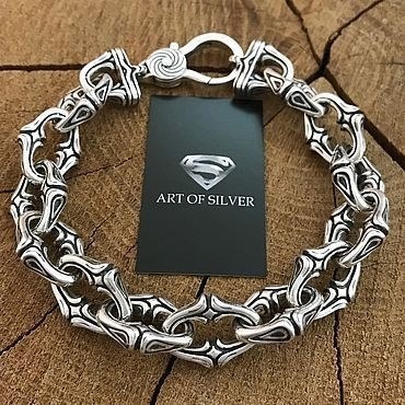 Art of Silver логотипімен және ағаш фонымен күміс білезік