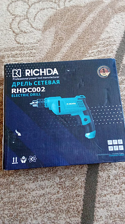 Упаковка электродрели Richda RHDC002 с изображением инструмента