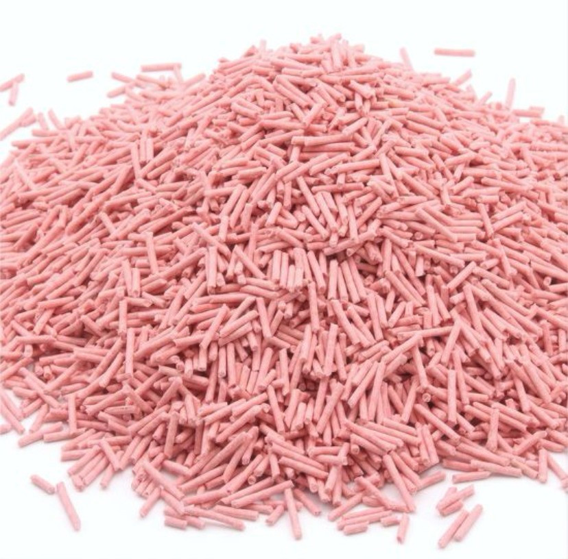 Розовый түсті порошокты гранулалардың штабелі