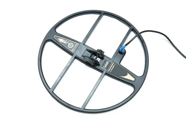 Жер астындағы объектілерді анықтау үшін дөңгелек катушкасы бар металлоискатель