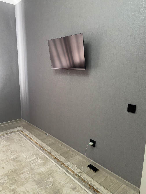 Бөлмедегі теледидармен қабырға