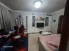 Заманалық қонақ бөлмесі теледидар мен ойын тері креслосымен