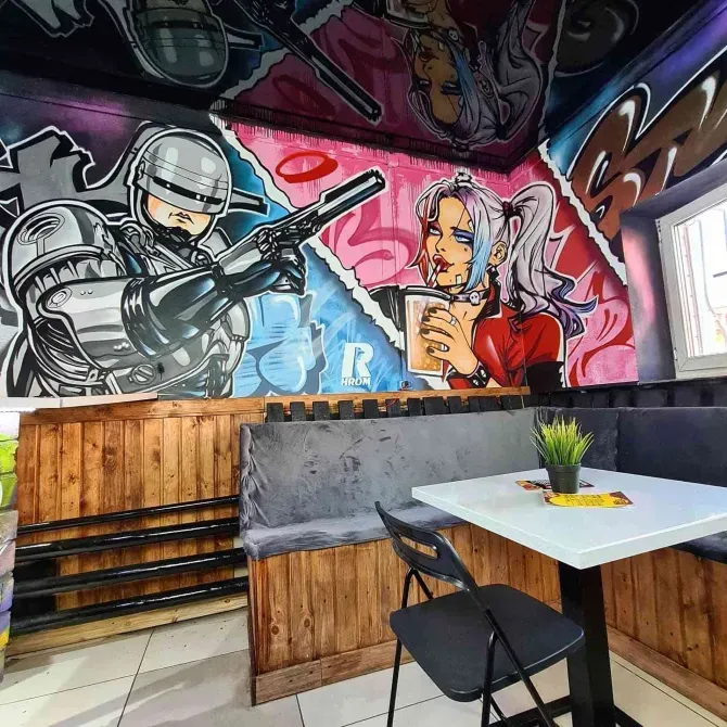 Граффити с изображением робота и девушки в кафе