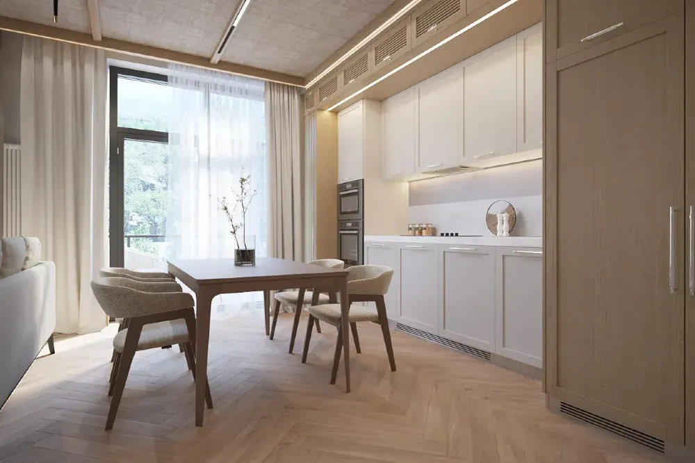 Светлая кухня-столовая с обеденным столом и современными кухонными шкафами