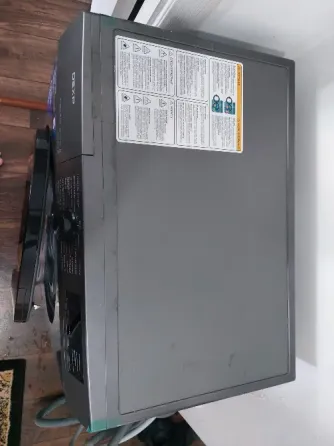 Стиральная машина DEXP с открытой дверцей и характеристиками