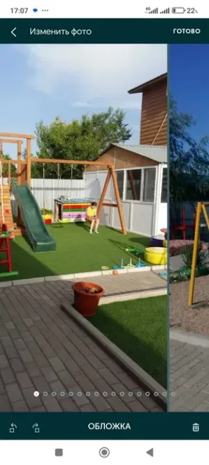 Двор с игровой площадкой и детской на траве