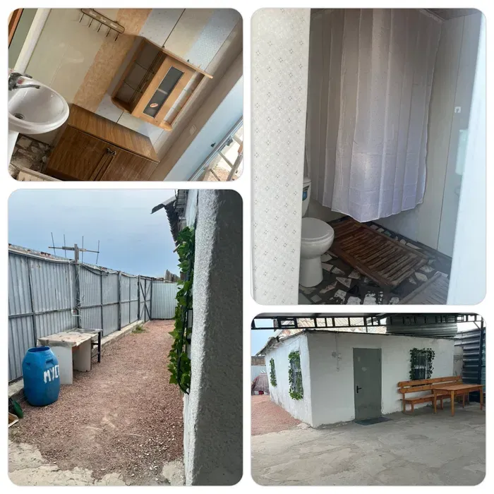 Унитаз бен душпен жабдықталған ванна бөлмесі