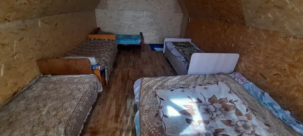 Уютная комната с кроватями