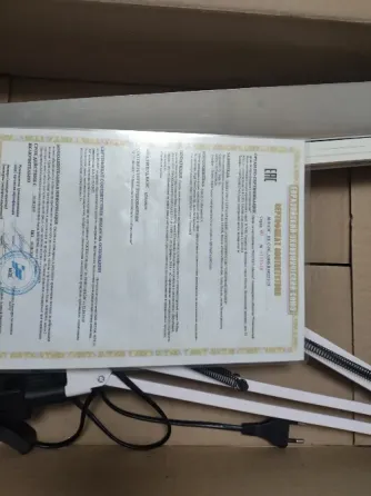 Документ с текстом в черном шрифте на белом фоне и печатью в правом верхнем углу