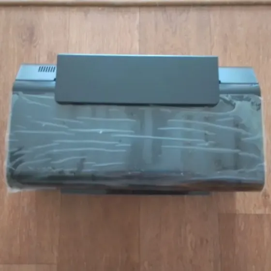 Принтердің қаптамасы үстінде