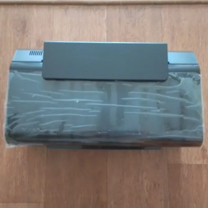 Принтердің қаптамасы үстінде