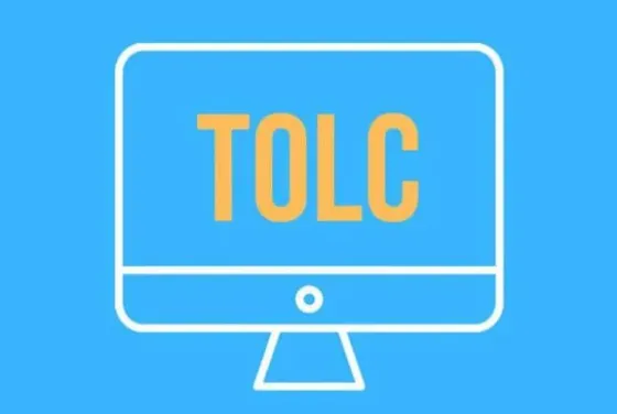 Монитор с надписью TOLC на синем фоне