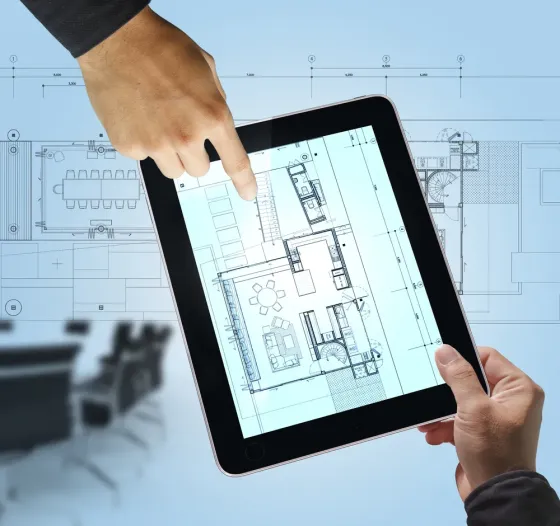 Планировка здания на планшете с чертежами