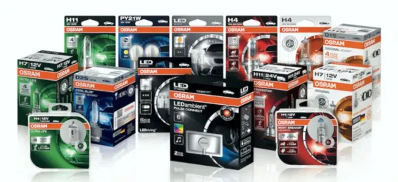 Коробки с автомобильными лампами OSRAM различных моделей и типов, представленные на белом фоне