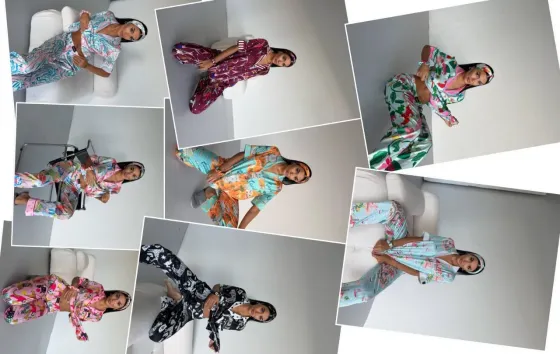 Стильная женщина в яркой одежде, позирующая на фоне светлой стены