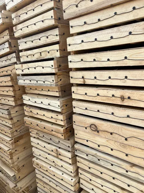 Стacked wooden crates showing distinctive designs and joints